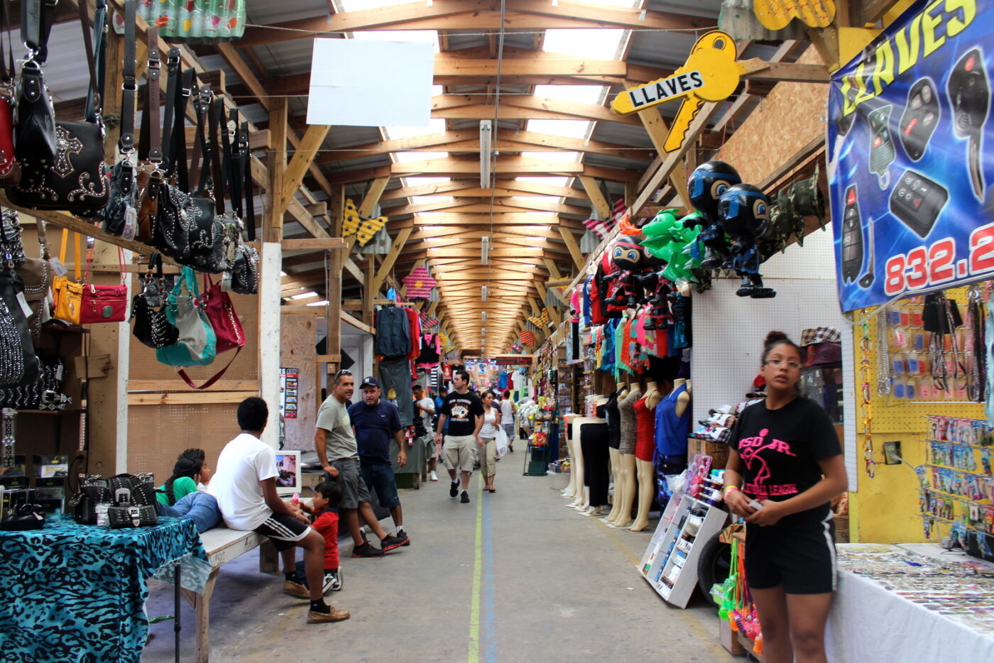 The aisles of the flea market stretch on for acres.