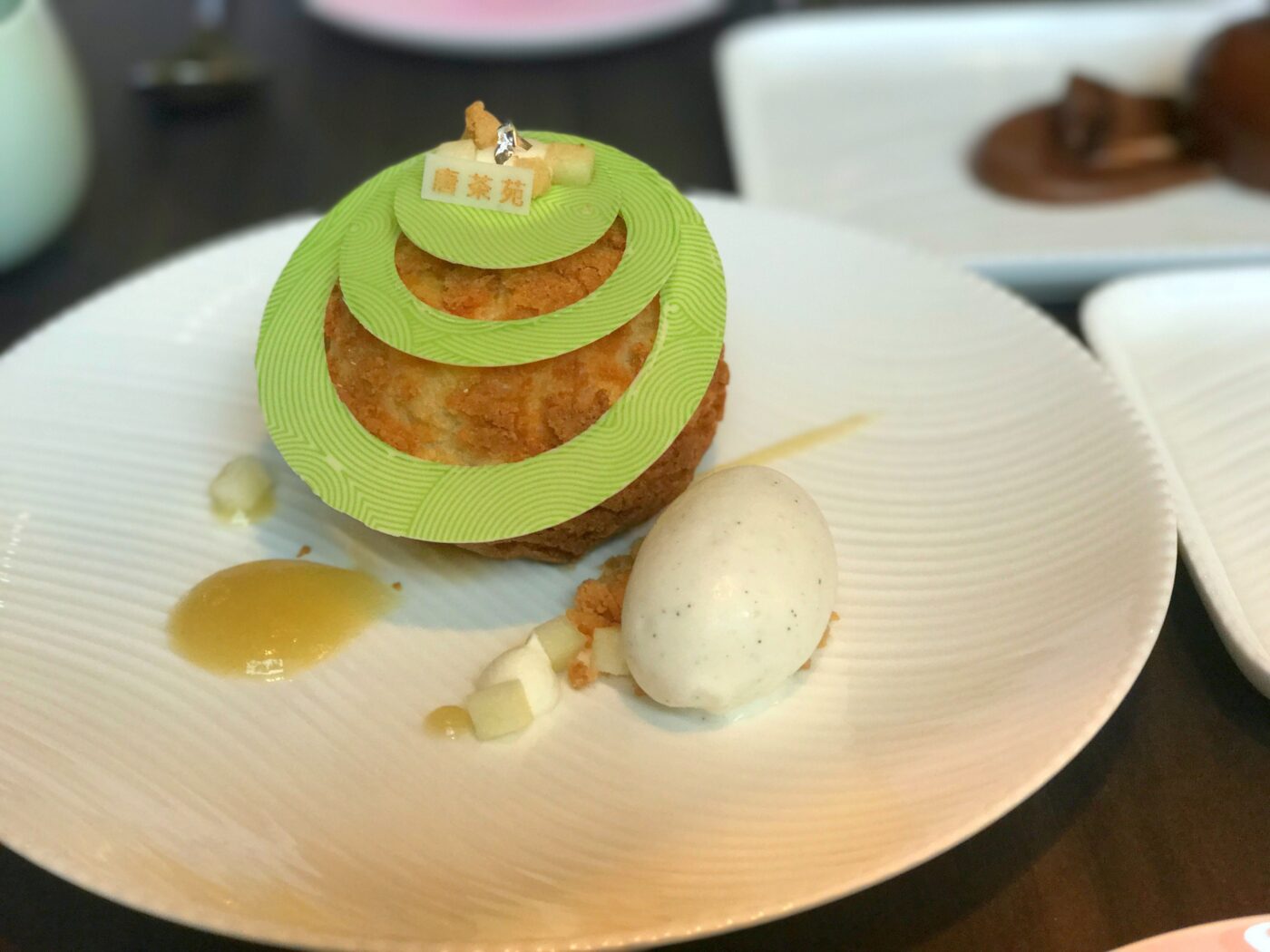Apple-vanilla choux, $12. This flaky cream puff is filled with tart apple pie filling sophisticated enough to deserve its crown of Saturn-like white chocolate rings. Buttermilk sorbet assures that the flavors are far from saccharine.