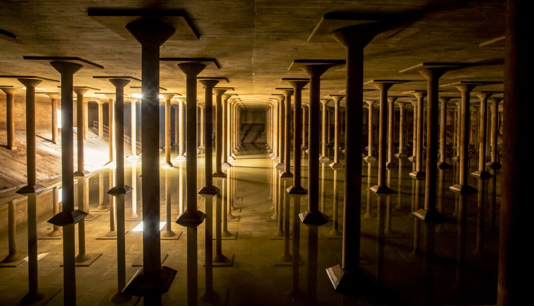 The inside of a cistern lit up in golden light.