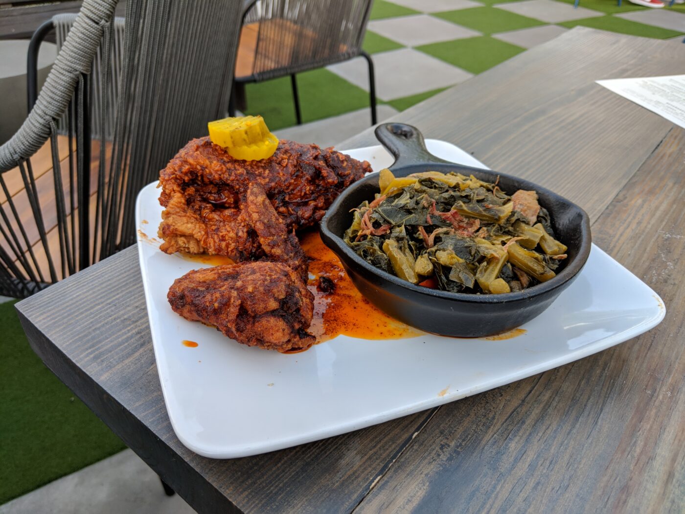 Nashville hot chicken, which typically comes with waffles ($17), plus a side of braised collard greens with smoked turkey ($7).