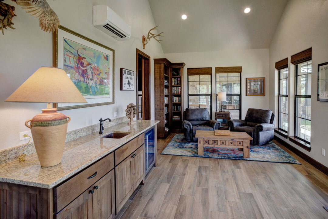 A living room with a touch of a western theme.