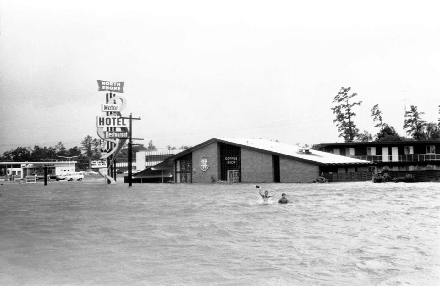On September 11, 1961, Hurricane Carla made landfall in Texas—the most intense tropical cyclone landfall in United State history. Tidal waves over 10 feet tall smashed into the coast between Galveston and Texas City, where a young Dan Rather reported live during the storm itself. The hurricane also brought heavy rainfall of up to 17 inches across the city, including North Shore. Here, guests of the North Shore Motor Hotel found a much larger swimming pool outside along the old Highway 73 (now Interstate 10) than the motel’s kidney-shaped pool, which was left underwater—along with much of the motel itself.