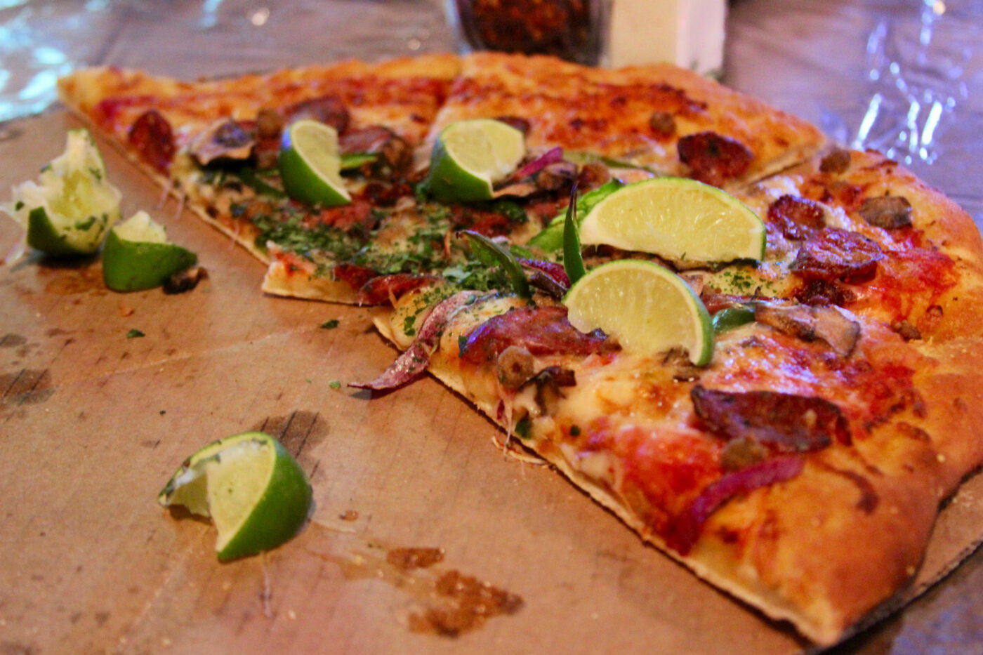 The Texas Revolution comes with spicy sausage from Kreuz Market and limes to squeeze across the top.