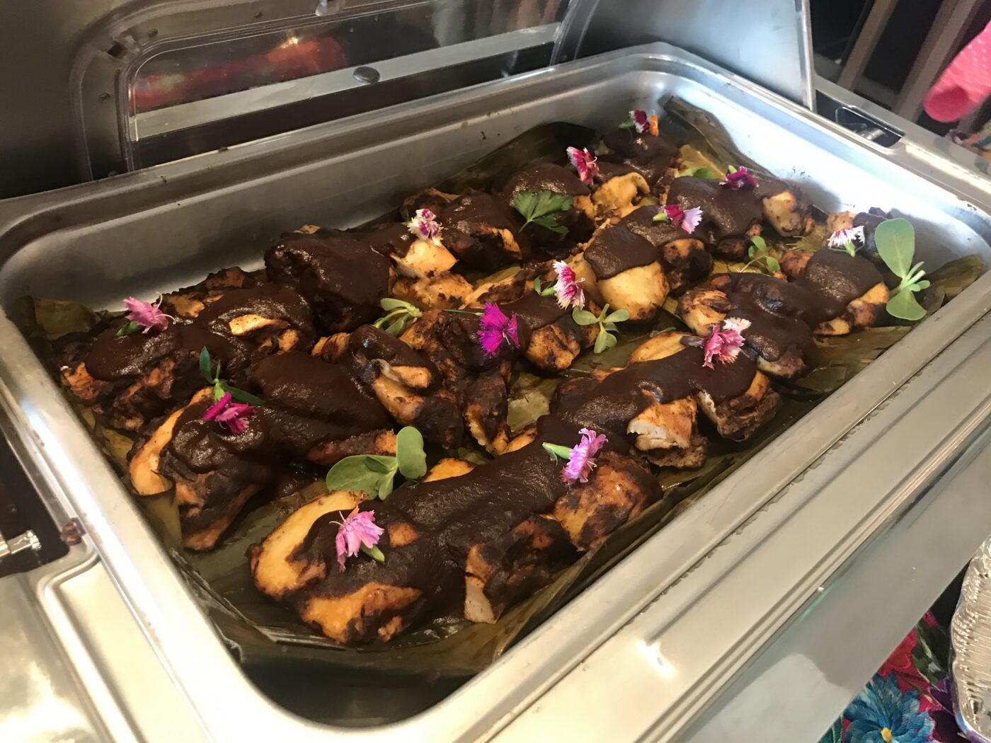 Tamales de pollo con mole negro are dark and chocolaty, but they're also likely the prettiest tamales you've ever seen.