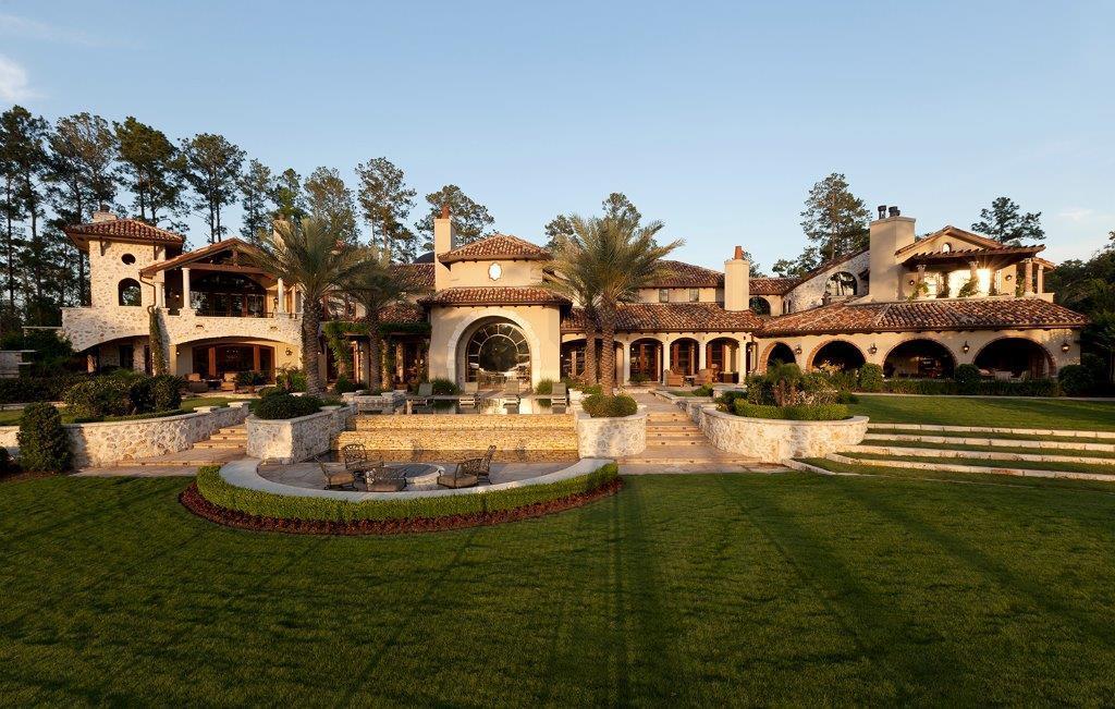Just down the street, this 5-bedroom hacienda style home is on the 9th hole of the adjacent Nicklaus-designed golf course, with 3,000 square foot of outdoor living space and a separate golf house connected via stone bridge.