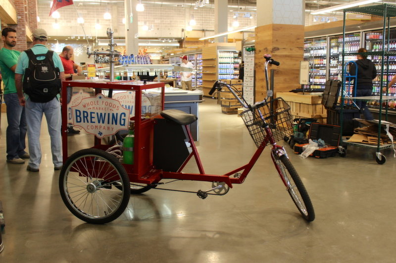 Whole Foods employees will ride this bicycle around the store, selling pints of beer.